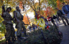 Visitors walk past the Three Servicemen statue at the Vietnam Veterans Memorial in Washington, D.C. Nov. 11, 2010. Hundreds gathered for the annual Veterans Day observance at the National Mall. (United States Department of Defense)