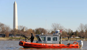 U.S. Coast Guard Petty Officer 2nd Class John Cantu, with the Coast Guard Maritime Safety and Security Team (MSST) based in Galveston, Texas, mans a mounted machine gun on a 25-foot Response Boat-Small in front of the Washington Monument in Washington, Jan. 19, 2013. The MSST and other Coast Guard units throughout the United States deployed to Washington to provide security for the 57th Presidential Inauguration. President Barack H. Obama was elected to a second four-year term in office Nov. 6, 2012. More than 5,000 U.S. Service members participated in or supported the inauguration. (DoD photo by Petty Officer 3rd Class Lisa Ferdinando, U.S. Coast Guard/Released)