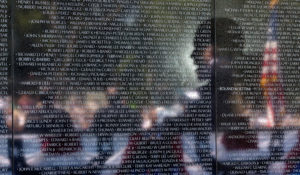 President Barack Obama is reflected in the Vietnam Veterans Memorial wall as he delivers remarks during the 50th Anniversary of the Vietnam War commemoration ceremony in Washington, D.C., May 28, 2012. (Official White House Photo by Pete Souza)