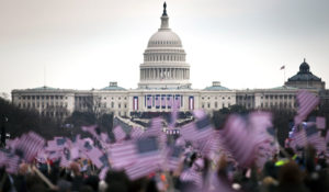 Attendees wave flags from the National Mall during the 57th presidential inauguration in Washington, D.C., Jan. 21, 2013. President Barack H. Obama was elected to a second four-year term in office Nov. 6, 2012. More than 5,000 U.S. Service members participated in or supported the inauguration. (U.S. Marine Corps photo by Staff Sgt. Mark Fayloga/Released)