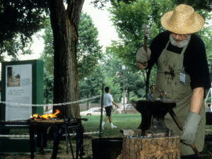 A Lithuanian blacksmith demonstrates his skills in the Baltic Nations program during the 1998 Smithsonian Folklife Festival. (Smithsonian Photo)