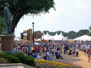 Crowds on the National Mall during the 2002 Smithsonian Folklife Festival, which featured the Silk Road. The annual Folklife Festival highlights grassroots cultures across the nation and around the world through performances and demonstrations of living traditions. The Festival, which began in 1967, occurs for two weeks every summer on the National Mall and attracts more than 1 million visitors. (Jeff Tinsley, Smithsonian Institution)