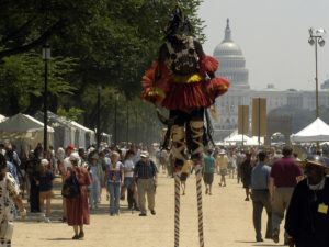 A Dogon dancer from Mali walks on stilts through the 2003 Smithsonian Folklife Festival on the National Mall. (Smithsonian)