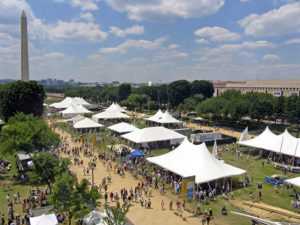 A view of the 2004 Smithsonian Folklife Festival. The annual Folklife Festival highlights grassroots cultures across the nation and around the world through performances and demonstrations of living traditions. The Festival, which began in 1967, occurs for two weeks every summer on the National Mall and attracts more than 1 million visitors. (Jeff Tinsley, Smithsonian Institution)