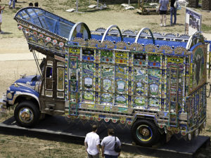 At the 2007 Smithsonian Folklife Festival, visitors admire the Pakistani hand-painted truck originally brought to the Smithsonian for the 2002 Folklife Festival. (Ken Rahaim/Smithsonian)