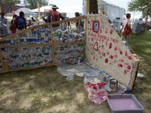 One section of the Bottle School Wall is completed during the 2011 Smithsonian Folklife Festival. (Peace Corps)