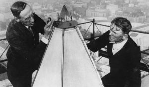 National Bureau of Standards engineer William M. Greig (left) and an unidentified man examine the tip and lighting rods at the top of the Washington Monument in 1934. (Courtesy: Library of Congress)