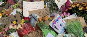 Mourners left flowers in tribute of Justice Ruth Bader Ginsburg near the Supreme Court in Washington DC (Photograph by Ellen Goldstein)